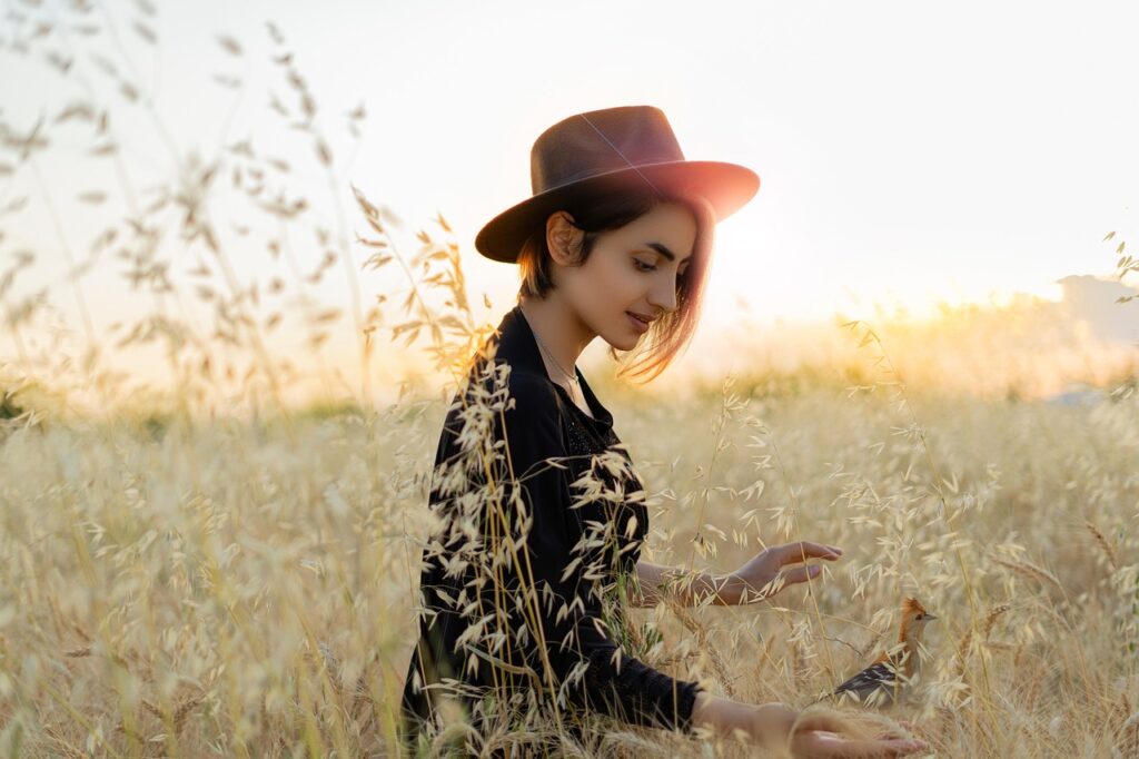 dis fashion , the girl is enjoying on land with bird